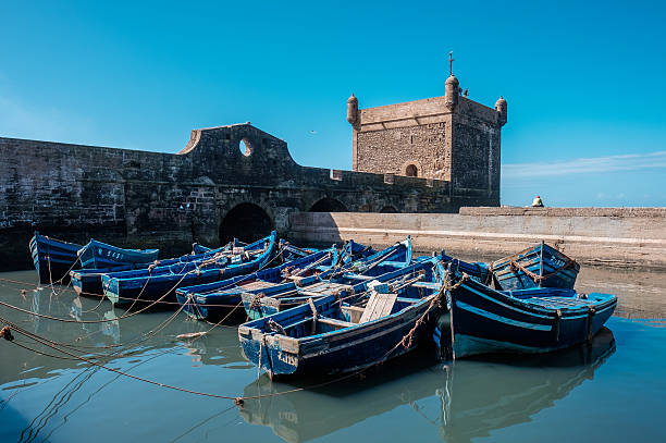 Group of blue boats in Essaouira, Morocco stock photo