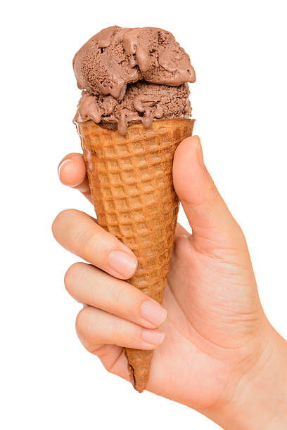 istock Hand holding chocolate ice cream cone isolated on white background 494025324