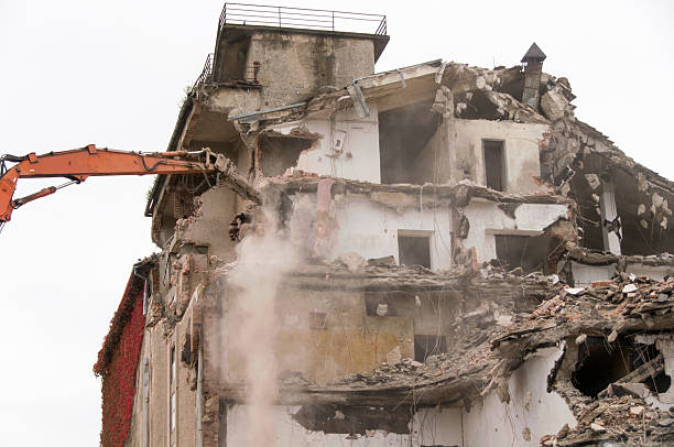 istock Building demolition and crashing by machinery for new construction. 494027178