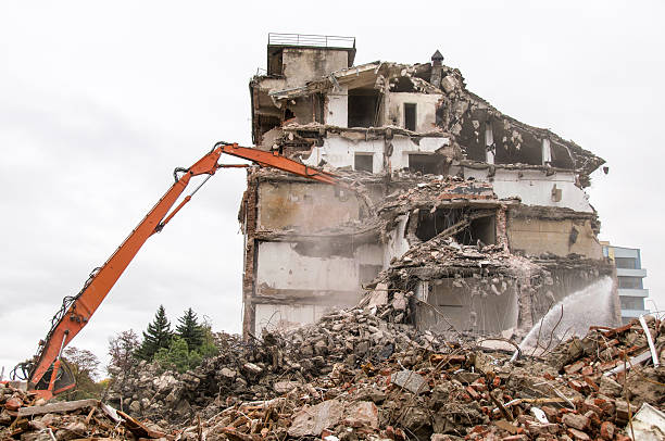 istock Building demolition and crashing by machinery for new construction. 494028478