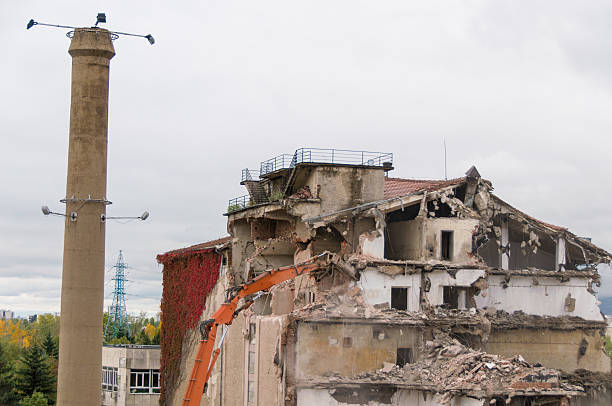 istock Building demolition and crashing by machinery for new construction. 494029146