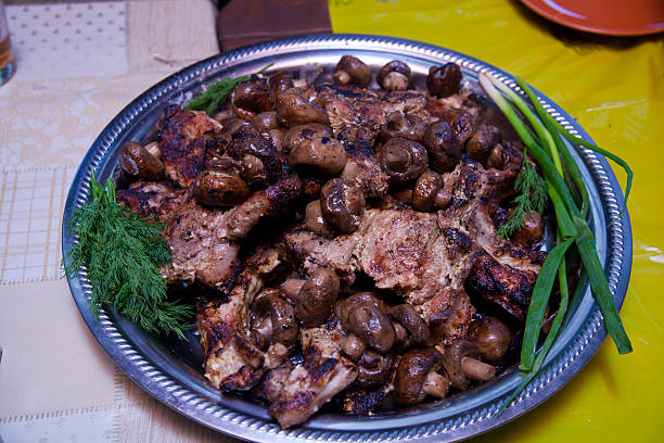 istock mushrooms and meat in plate 494029886