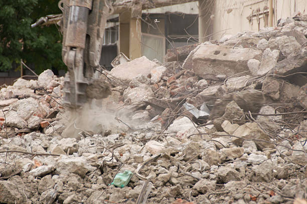 istock Building demolition and crashing by machinery for new construction. 494030350
