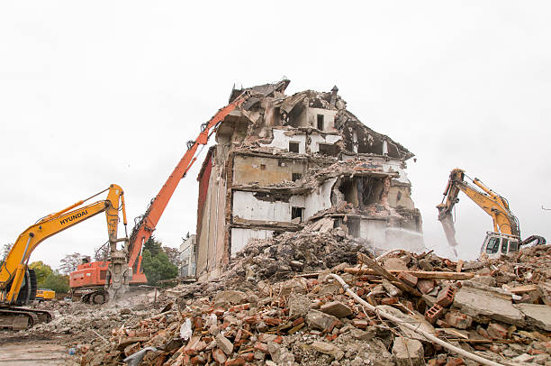 istock Building demolition and crashing by machinery for new construction. 494031168