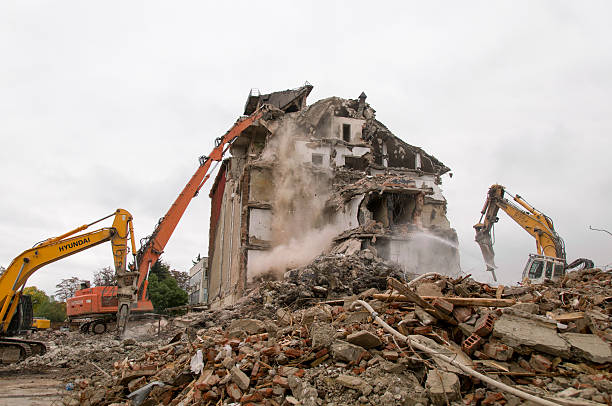 istock Building demolition and crashing by machinery for new construction. 494031194
