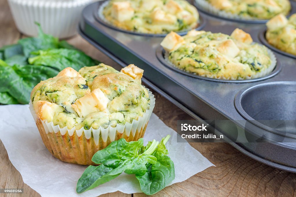 Freshly baked snack muffins with spinach and feta cheese 2015 Stock Photo