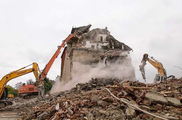 istock Building demolition and crashing by machinery for new construction. 494031274