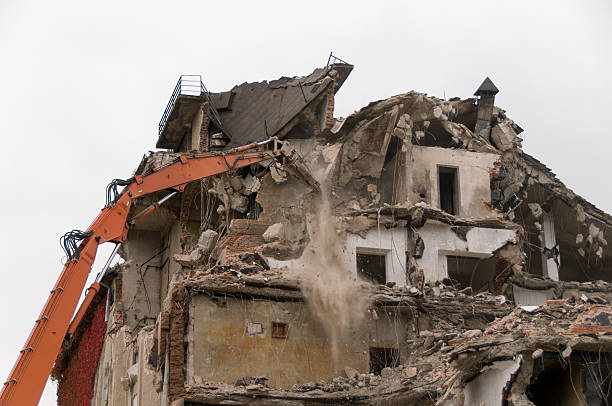istock Building demolition and crashing by machinery for new construction. 494031416
