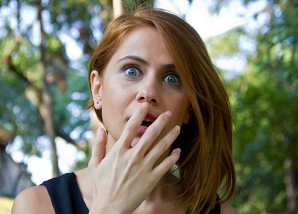istock young woman looking surprised 494032170