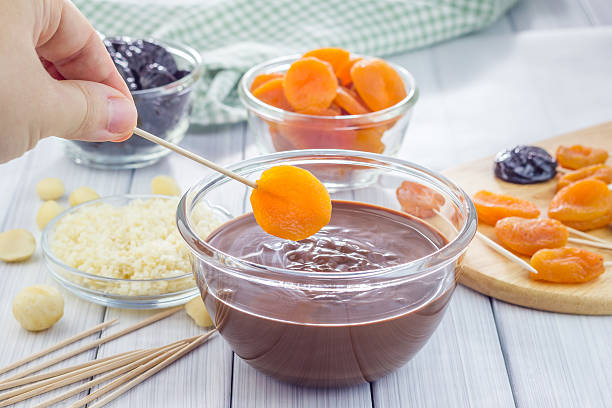 istock Making apricot and prunes lollipops 494032434