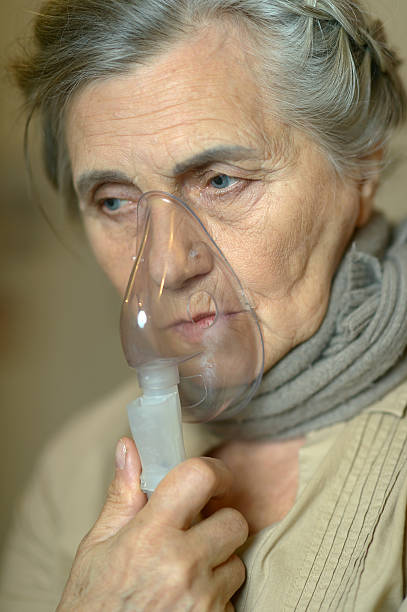 istock Sick Senior woman with inhaler 494034990