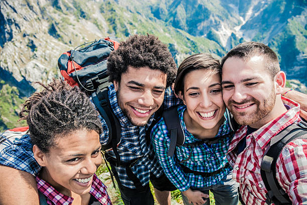 istock Group of friend taking selfie in mountain 494035553