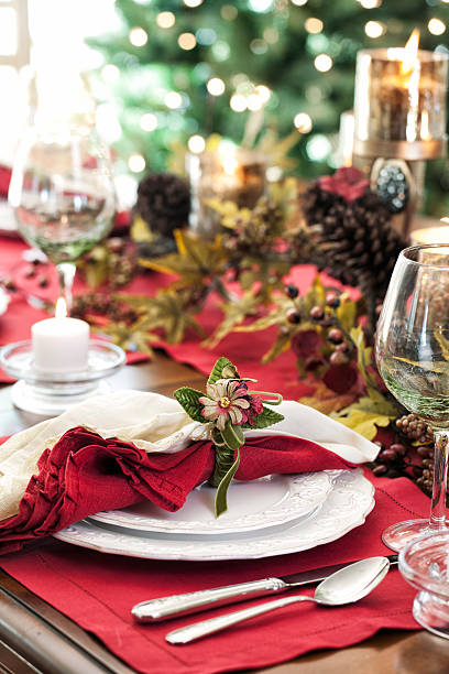 istock Holiday Dining Table in Front of Christmas Tree Lights 494036122