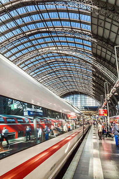 Frankfurt, Germany - May 16, 2014: people inside the Frankfurt central station in Frankfurt, Germany. With about 350.000 passengers per day its the most frequented railway station in Germany.