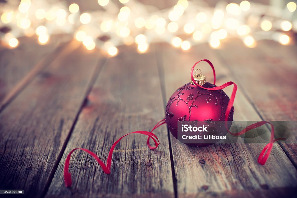 Christmas Ornament Baubles on Old Wood Background with Defocused Lights 2015 Stock Photo