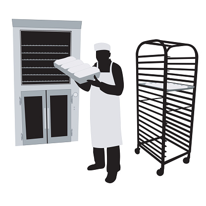 A vector silhouette illustration of a baker pulling fresh baked bread out of an industrial oven.  He wears a bakers hat and an apron and stands near a baking cooling rack.