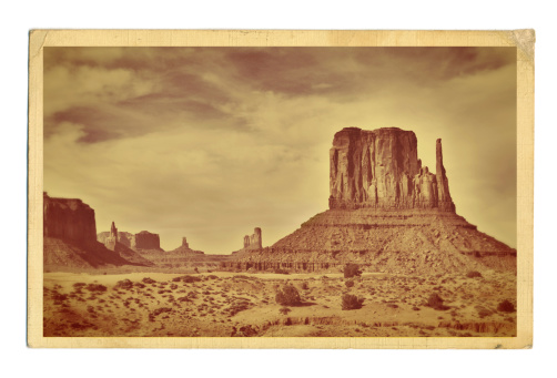Subject: A retro postcard of the landscape of the American Southwest. The image on the postcard is an original photograph produced for this stock photo, it is not a scan copy of an actual postcard image.