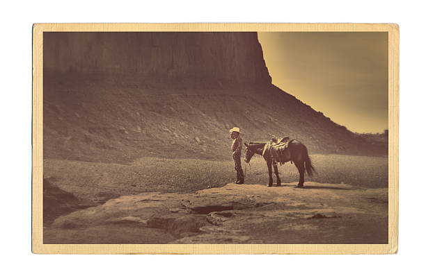 Western Cowboy Retro Postcard Subject: A retro postcard of a Cowboy and the landscape of the American Southwest. The image on the postcard is an original photograph produced for this stock photo, it is not a scan copy of an actual postcard image. monument valley photos stock pictures, royalty-free photos & images