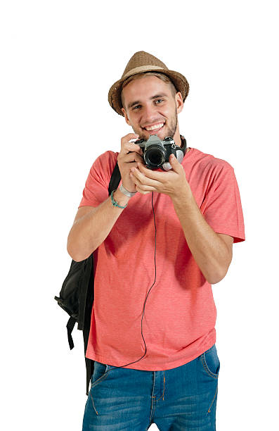 young handsome guy with film camera isolated on white stock photo