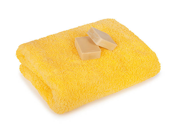 istock Stack of clean fresh towels in the green basin isolated 494041563