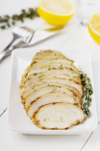 istock Chicken fillet slices with lemon and thyme 494041951