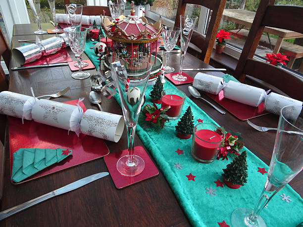 istock Image of decorated dining table at Christmas time, place-settings, crackers 494054832