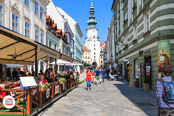 Bratislava, Slovakia - September 23, 2015: tourists walk on Michalska street in Bratislava. In Middle Ages this street was part of a busy trade route linking the Baltic Sea with the Danube