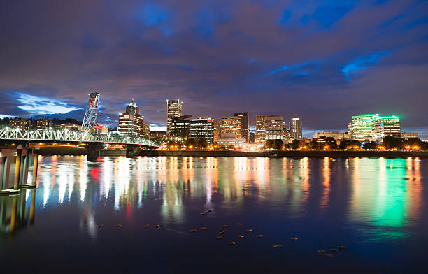 istock Portland Oregon Waterfront Willamette River Flowing Under Hawthorne Bridge 494056164