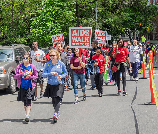 AIDS WALK 2014 New York, NY, USA - May 18, 2014: Unidentified participants walk at the AIDS Walk New York 2014 on Riverside Drive, Manhattan aids walk stock pictures, royalty-free photos & images