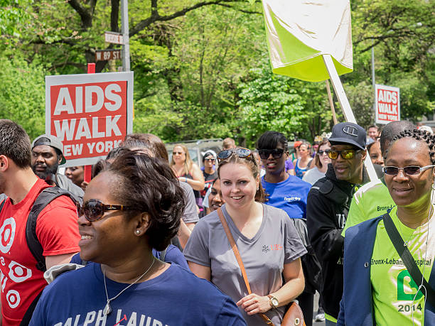 AIDS WALK 2014 New York, NY, USA - May 18, 2014: Unidentified participants walk at the AIDS Walk New York 2014 on Riverside Drive, Manhattan aids walk stock pictures, royalty-free photos & images