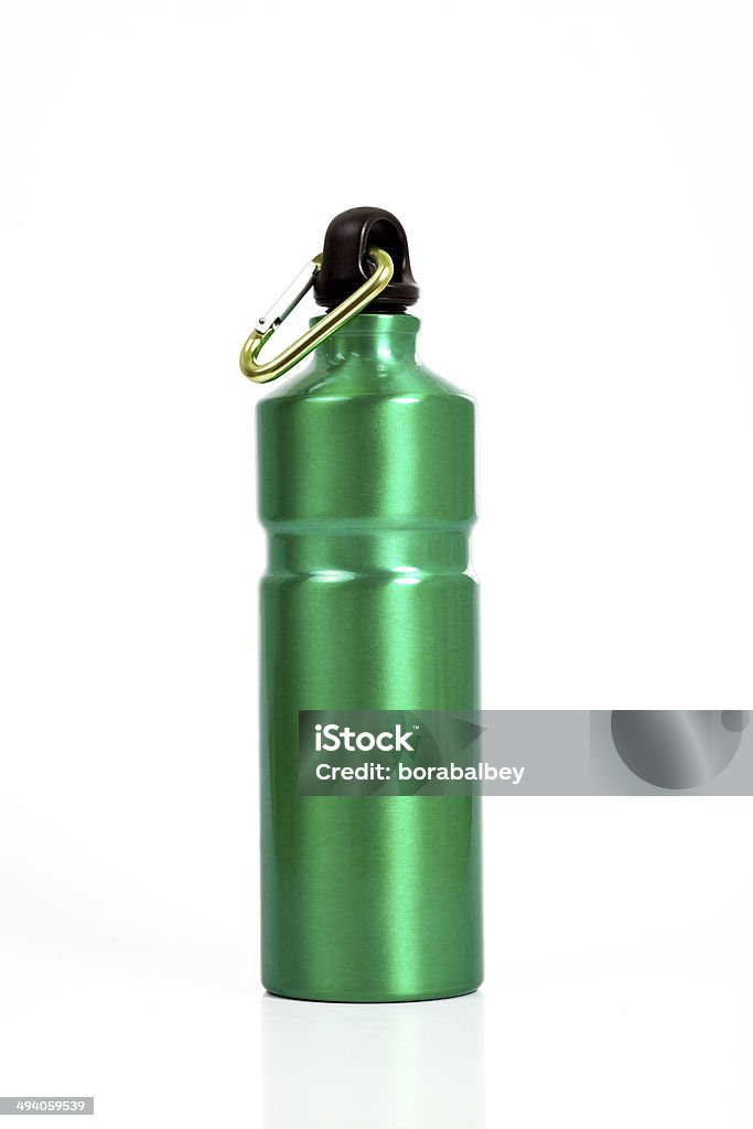 Full length green waterbottle A green waterbottle of the type used by climbers, walkers and campers. A karabiner is attached to the top. Water Canteen Stock Photo