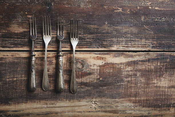 istock four forks on a wooden table 494060786