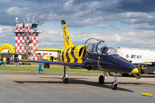 Baltic Bees Jet Team with L-39 Albatros planes on runway Hradec Kralove, Czech republic - September 5, 2015 Baltic Bees Jet Team with Aero L-39 Albatros planes standing on a runway at the CIAF - Czech international air fest on September 5, 2015 in Hradec Kralove, Czech republic. aero l 39 albatros stock pictures, royalty-free photos & images