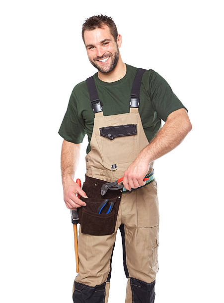 istock Portrait of smiling worker in brown uniform with tools 494061957