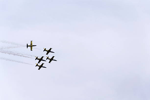 Baltic Bees Jet Team flying with Aero L-39 Albatros planes Hradec Kralove, Czech republic - September 5, 2015: Baltic Bees Jet Team flying Baltic Bees Jet Team flying with Aero L-39 Albatros planes at the CIAF - Czech international air fest on September 5, 2015 in Hradec Kralove, Czech republic. aero l 39 albatros stock pictures, royalty-free photos & images