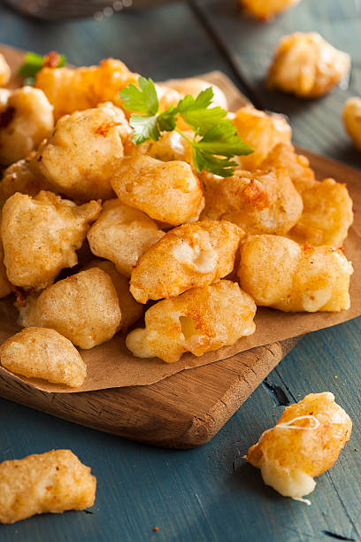 Beer Battered Wisconsin Cheese Curds Beer Battered Wisconsin Cheese Curds with Dipping Sauce curd cheese stock pictures, royalty-free photos & images