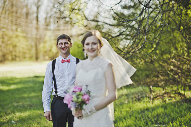 istock Newlyweds hugging on the background of the forest 494063444