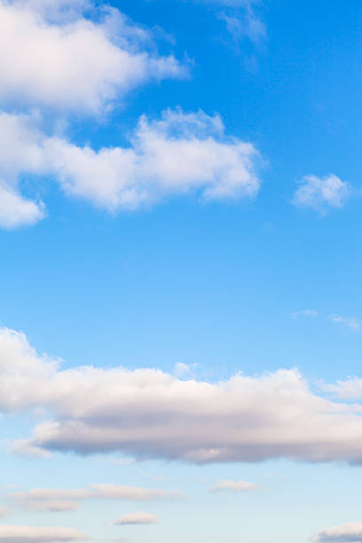 natural background - white clouds in blue sky in autumn day