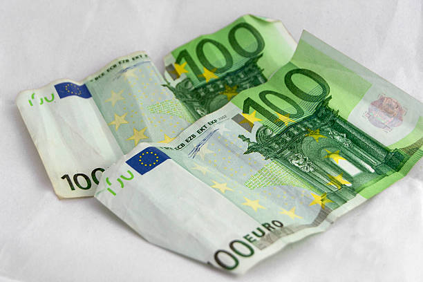 istock Stacks of  euro coins and banknotes 494066054