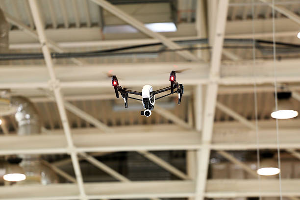 Modern  dron  flying with high resolution camera in the factory