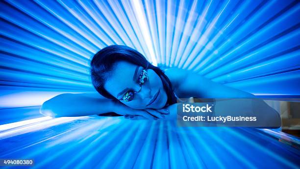 Beauty In Solarium Stock Photo - Download Image Now - Tanning Bed, Women, Ultraviolet Light