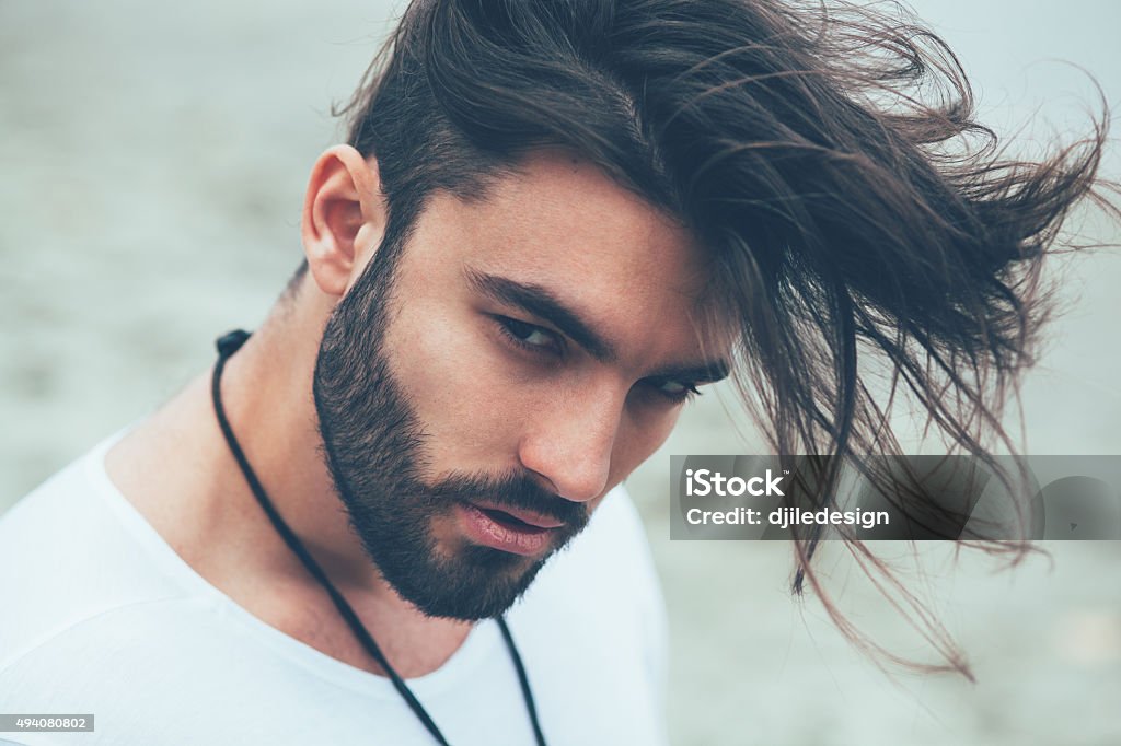 Portrait of a man with beard and modern hairstyle Men Stock Photo