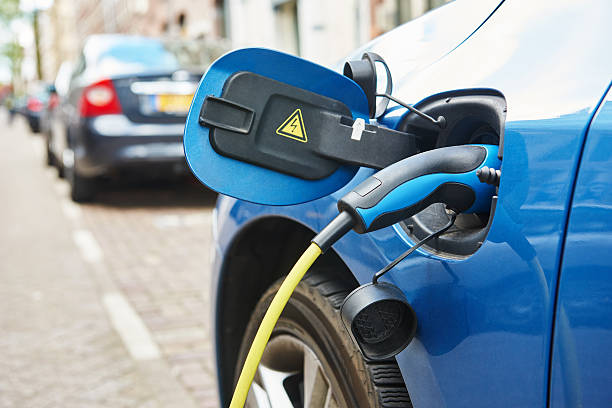 istock power supply plugged into an electric car during charging 494081548
