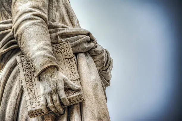 close up of Dante Alighieri statue in Florence, Italy