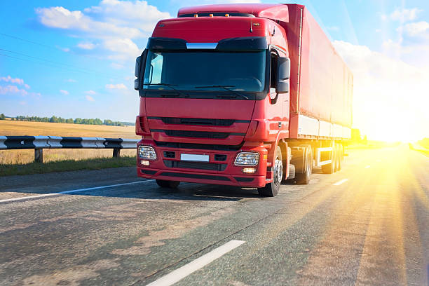 istock red truck on country highway 494086670