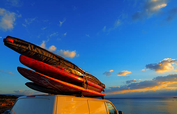 istock van with surfboards on the roof 494087016