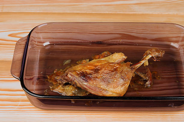 istock Roast duck in glass pan on wooden table 494087020