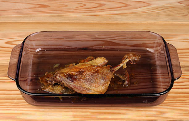 istock Roast duck in glass pan on wooden table 494087204