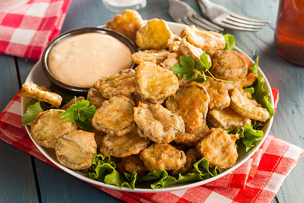 Delicious Battered Fried Pickles Delicious Battered Fried Pickles with Dipping Sauce pickle stock pictures, royalty-free photos & images