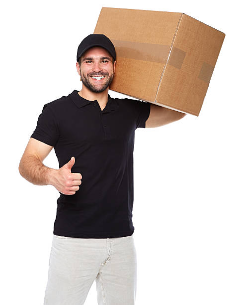 istock Smiling delivery man giving cardbox 494091129